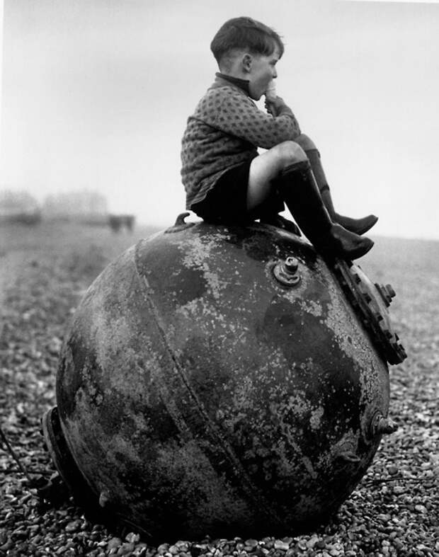 01 - A boy sitting on a sea mine