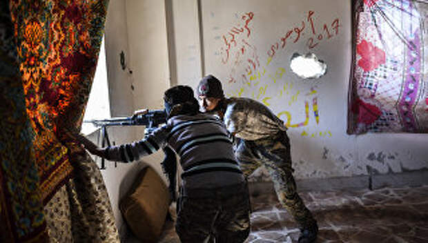 Члены Сирийских демократических сил (SDF), поддерживаемых спецслужбами США, в Ракке. 2 октября 2017