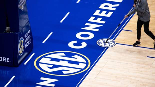 A view of the SEC logo on the basketball court.