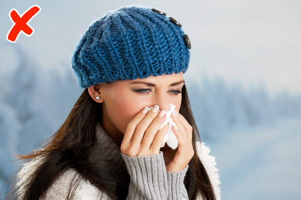 Pretty girl has flu and fever in winter day outdoor