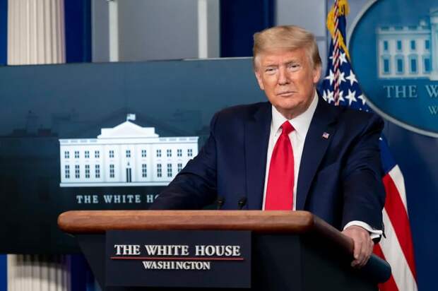 President Donald J. Trump standing at a White House podium.
