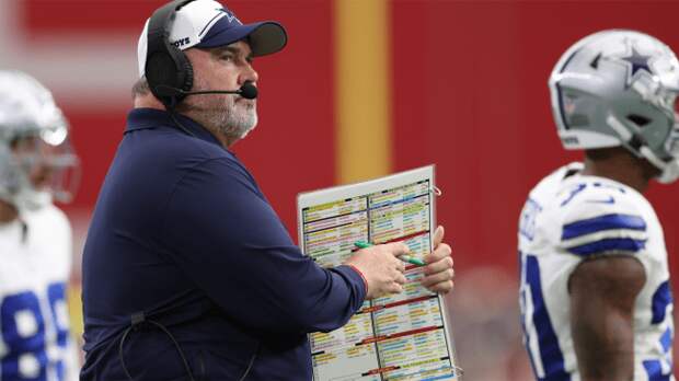 dallas cowboys coach mike mccarthy holds play call sheet