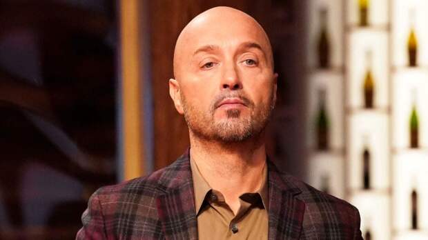 Judge Joe Bastianich appearing stoic while judging Masterchef.