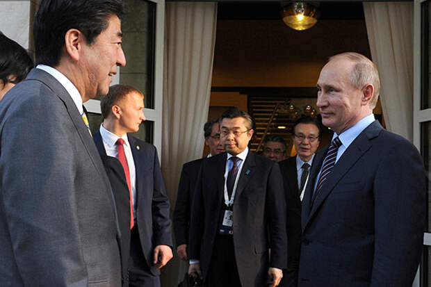Russian President Vladimir Putin (R) meets with Japanese Prime Minister Shinzo Abe at the Bocharov Ruchei state residence in Sochi, Russia, May 6, 2016. Michael Klimentyev/Sputnik/Kremlin via Reuters ATTENTION EDITORS - THIS IMAGE WAS PROVIDED BY A THIRD PARTY. EDITORIAL USE ONLY.? - RTX2D6G8