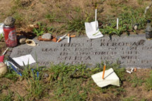 Original headstone with various offerings