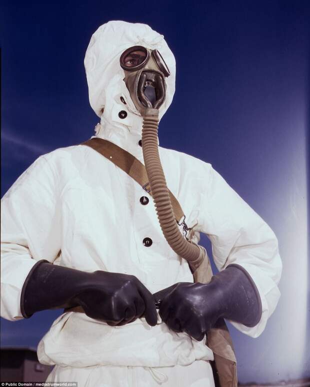 A sailor at the Naval Air Base wears the new type protective clothing and gas mask designed for use in chemical warfare, in Corpus Christi, Texas, in August of 1942