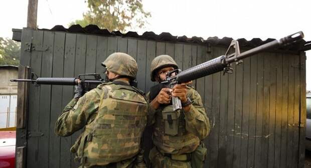 Brazilian naval personell point their we