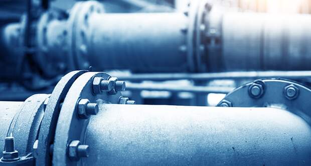 a photo of pipes used to transport water in a sewage treatement plant