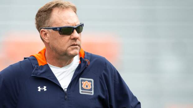 Hugh Freeze walks the field before a matchup against Texas A&M.