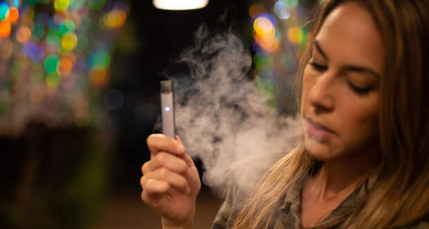 person using an e-cigarette