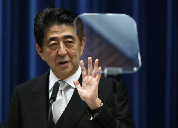 Japan's Prime Minister Shinzo Abe speaks next to a teleprompter during a news conference after reshuffling his cabinet, at his official residence in Tokyo September 3, 2014. REUTERS/Yuya Shino