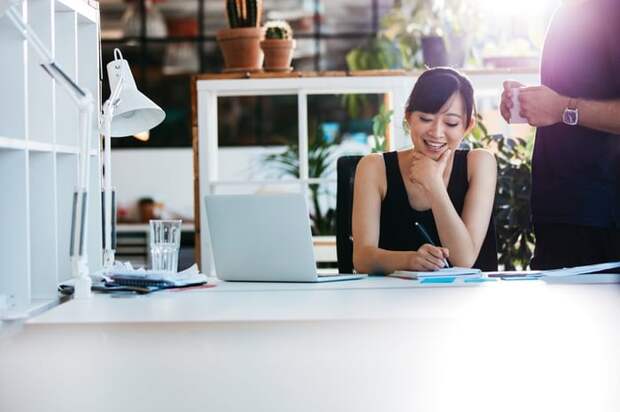 Smiling woman working in a bright office.