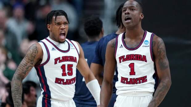 Two FAU players celebrate a big play.