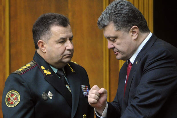 Ukraine's President Petro Poroshenko, right, speaks with new defense minister Stepan Poltorak in parliament in Kiev, Ukraine, Tuesday, Oct. 14, 2014. Ukraine's parliament has approved a new defense minister as the country remains bogged down in daily clashes with pro-Russian separatist forces in its industrial eastern regions. (AP Photo/Andrew Kravchenko, 