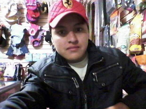 Pic shows: Oscar Otero Aguilar tried to pose with a live gun to take a selfie and shot himself in the head. A young Mexican vet's desire to take ever more impressive selfies caused his death when he tried to pose with a live gun ñ and shot himself in the head. Twenty-one-year-old Oscar Otero Aguilar from the capital Mexico City had been snapped in images posted on his Facebook page, which had now been taken down, in front of fast cars, sitting on expensive motorbikes, hugging beautiful women and even posing in a band. But the man's endless search for the most impressive photo ended when he borrowed a gun and decided to take some snaps on his mobile phone as he waved it around. The alarm was raised by his neighbour Manfredo Paez Paez, 57, who told local media: "I heard a gunshot, and then I heard somebody screaming and realised somebody had been hurt. I called the police straight away and when they arrived they found that he was still alive." Medics were quickly called out but the young man died on the way to hospital in an ambulance. Police who questioned those who were in the flat when the accident happened said that he had been messing around with the gun and taking pictures when it accidentally went off. They said that they believed the young man had not realised there was a bullet in the gun when it had been handed to him. According to the dead man's Facebook page, he worked as a vet in a pet shop looking after the animals. (ends)