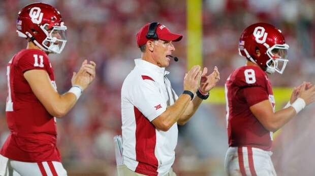 Brent Venables reacts to a play on the field.