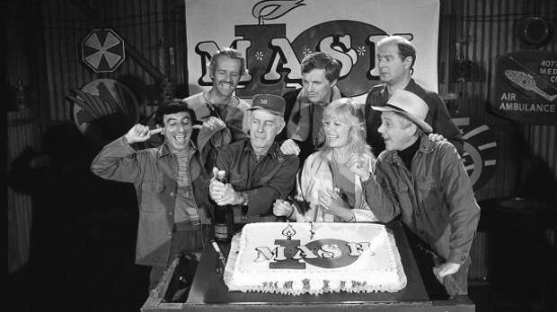 FILE - In this Oct. 22, 1981, file photo, Jamie Farr, from front left, plugs his ears as cast members of the 