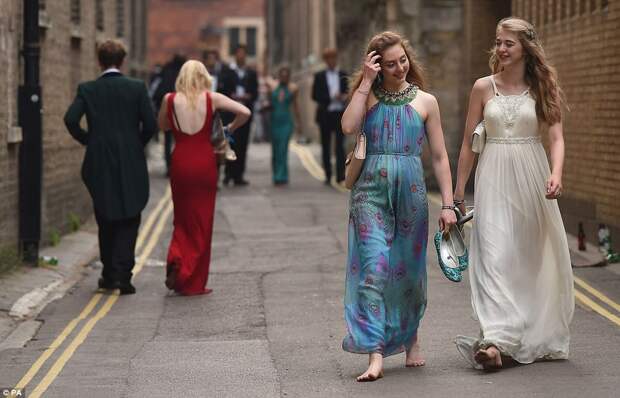 Good night? Students from Trinity, Clare and and Jesus College's at Cambridge University make their way home this morning