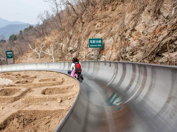 slide-down-the-great-wall-of-china-on-the-5184-foot-long-toboggan-run-which-departs-from-a-section-of-the-wall-in-mutianyu