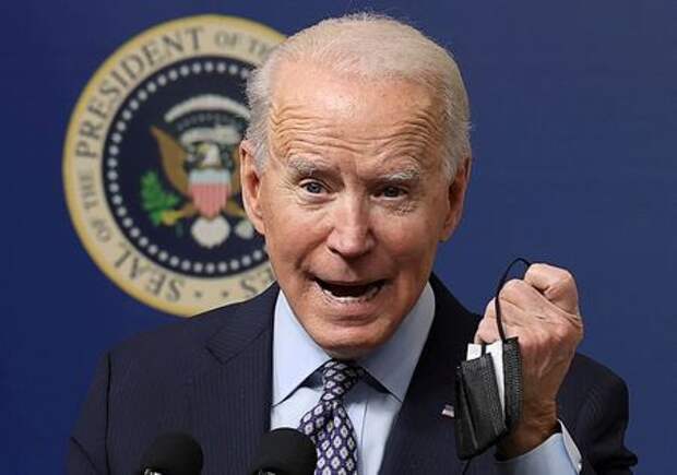 U.S. President Joe Biden displays his face mask as he speaks during an event to commemorate the 50 millionth coronavirus disease (COVID-19) vaccination in the South Court Auditorium at the White House in Washington, U.S., February 25, 2021. REUTERS/Jonathan Ernst U.S. President Joe Biden displays his face mask as he speaks during an event to commemorate the 50 millionth coronavirus disease (COVID-19) vaccination in the South Court Auditorium at the White House in Washington, U.S., February 25, 2021. REUTERS/Jonathan Ernst