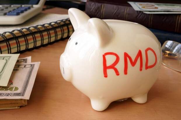 Piggy bank with the letters RMD written on the side. 