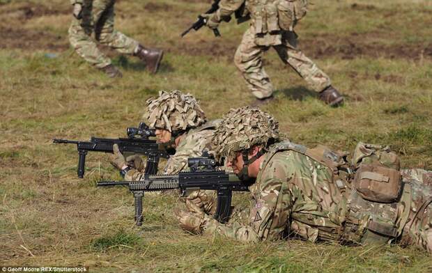 Members of the Mercian regiment joined battle with their imaginary foe, pictured here equipped with SA-80 assault rifles 