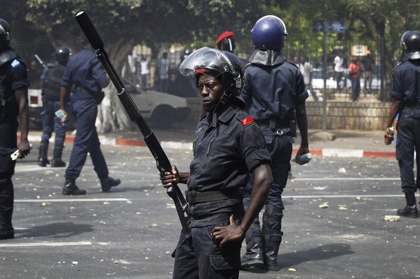 Riot police control an intersection near the National Assembly during a demonstration in Senegal's capital Dakar