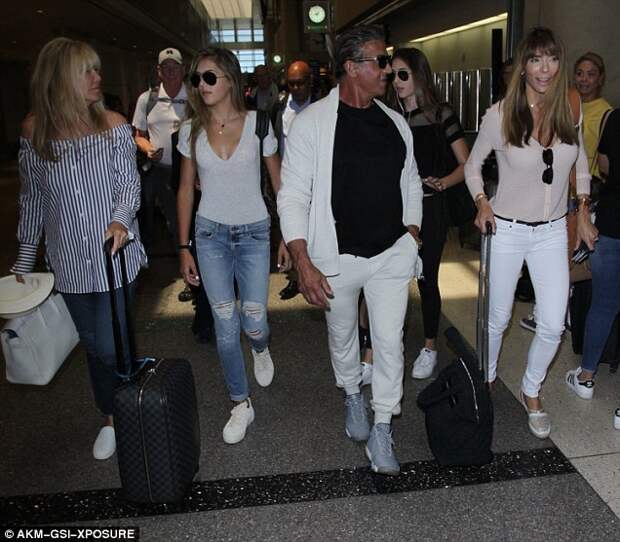 Jet-setters: The previous evening, Sylvester was seen arriving at Los Angeles International Airport with his loved ones 