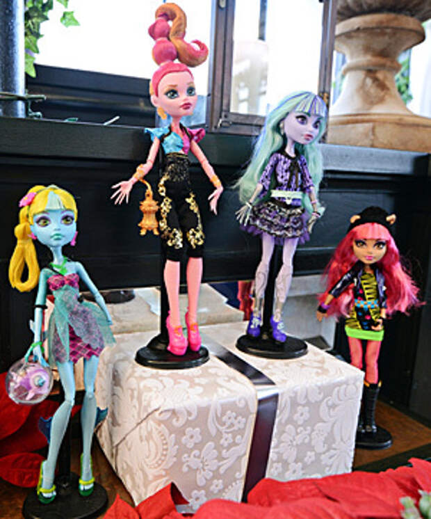 Mattel Inc.'s, Monster High 13 Wishes doll assortment including Lagoona Blue, from left, Gigi Grant, Twyla and Howleen Wolf, stands on display at the company's Get Your Santa Together event in New York, U.S., on Thursday, June 20, 2013. Mattel, Inc., a toy manufacturing company founded in 1945, produces brands that include Fisher Price, Barbie dolls, Monster High dolls, Hot Wheels and Matchbox toys, Masters of the Universe, American Girl dolls, board games, WWE Toys, and early-1980s video game systems. Photographer: Peter Foley/Bloomberg