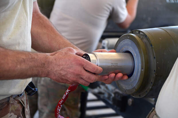An Airman assigned to the 455th Expeditionary Maintenance Squadron installs an FMU-152 tail fuse into the end of a GBU-38 bomb at Bagram Airfield, Afghanistan Aug. 14, 2014. The GBU-38 is utilized by the F-16C Fighting Falcon. . (U.S. Air Force photo by M